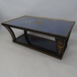A mid-century ebonised 2-tier coffee table, with inset glass top and painted decoration, 112 x 47