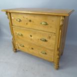 A polished pine chest of 3 long drawers, with carved decoration, 98 x 82 x 49cm