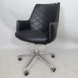 A modern faux leather-upholstered swivel desk chair, on chrome 5-star base