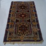 A red/brown ground Afghan Baluchi rug, 190 x 115cm