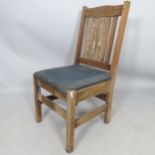 An American Arts and Crafts Mission hall chair in weathered oak, with maker's label, JM Young & Sons