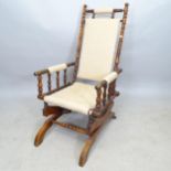 An fruitwood American rocking chair