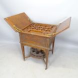 An Antique oak metamorphic drinks cabinet/table, by Mappin & Webb, the internal tray fitted with a