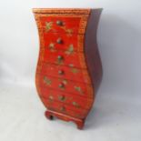 A Chinese red lacquered chest of 7 drawers, of shaped form, with painted decoration, 46cm x 87cm x