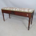 A 1930s mahogany and upholstered duet piano stool, with lifting seat, 108 x 56 x 40cm