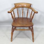 An elm-seated smoker's bow-arm chair