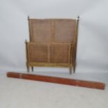 A mid-century French cane-panelled single bed, with side rails