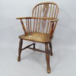 An Antique oak and elm-seated comb-back kitchen chair
