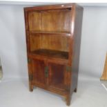A modern Oriental mahogany open cabinet with cupboards under, 95 x 174 x 52cm