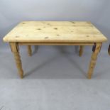 A pine farmhouse kitchen table, 137cm x 77cm x 90cm