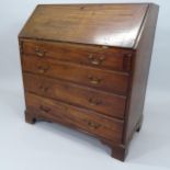 A Georgian mahogany bureau, the fall-front revealing a fitted interior with 3 long drawers below, on