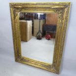 A contemporary gilt-framed bevel-edge wall mirror, 130cm x 160cm