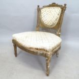 An Antique giltwood framed and upholstered parlour chair, with carved decoration
