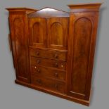 A 19th century mahogany sentry box compactum wardrobe in 7 sections, consisting of a centre