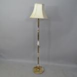 An onyx and brass standard lamp with shade, height to bayonet 136cm