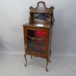 An Edwardian mahogany music cabinet, with raised mirrored back on cabriole legs, 59 x 150 x 38cm (