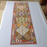 A Chobi Kilim runner, 257 x 80cm