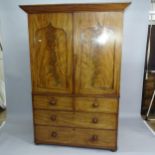 A Victorian flame veneered mahogany 2-section linen press, the top section having a single hanging