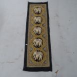 An Indian wall hanging with a silver and gold thread and raised elephant decoration, 140 x 45cm