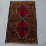 A red ground Beluchi rug, 143 x 88cm