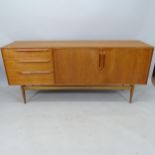 A mid-century teak sideboard by Mcintosh, having 3 drawers and shelf fitted interior, with maker's