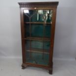 A 19th century oak bookcase. with single glazed door and 3 adjustable shelves, on bracket feet, 76 x