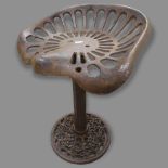 A Vintage cast-iron tractor-seat stool, H50cm