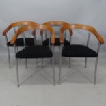 A set of 4 mid-century Danish design armchairs, with shaped wood backs and metal legs