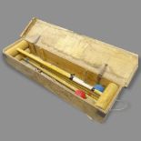 A Vintage 4-player croquet set, in pine box