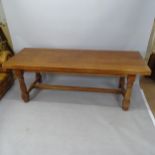 An Antique oak refectory dining table, on turned legs with H-shaped stretcher, 220 x 78 x 80cm