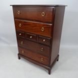 A modern chest of 3 short and 4 long drawers, on bracket feet, 82cm x 114cm x 47cm