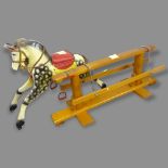 A Vintage painted wooden rocking horse, L130cm (A/F)