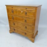 An early 20th century walnut chest of 4 long drawers with brushing slide, on bracket feet, 78cm x