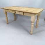 An Antique pine kitchen table, with single fitted drawer, on turned legs, 153cm x 77cm x 75cm