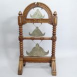 3 graduated Oriental bronze gongs, in oak stand, 54cm x 98cm