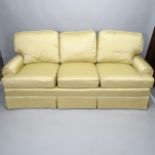 A contemporary 3-seater Chesterfield style sofa, upholstered in champagne coloured silk, Dupion with