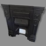 A painted wrought-iron fire surround, 99cm x 107cm