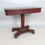 A 19th Century rosewood fold-over card table, with octagonal central column on platform base, 91 x