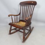 A simulated rosewood rocking chair