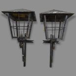 A pair of wrought-iron exterior light fittings in the form of lanterns, 33 x 80 x 33cm