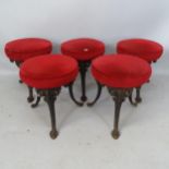 A set of 5 upholstered stools, on cast-iron legs, each 37 x 44cm