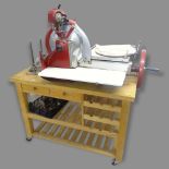 A Berkel & Parnall's manual meat slicing machine, mounted on a butcher's block, overall 137 x 154