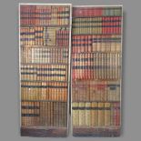 A pair of internal wooden doors, in the form of bookcases, 76 x 197cm