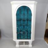 A painted pine corner cupboard with wrought-iron doors, 105 x 200 x 52cm