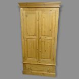 A modern pine 3-section wardrobe, with 2 panelled doors and drawer below, 102 x 198 x 56m
