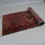 A red ground Afghan design runner, 336 x 86cm Areas of heavy wear particularly down the central