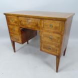 An Antique crossbanded mahogany and satinwood-strung kneehole writing desk, with 7 fitted drawers,