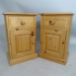 A pair of modern pine bedside pot cupboards, 38 x 61 x 30cm