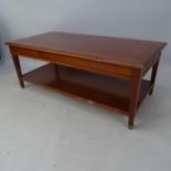 A Grange cross-banded mahogany 2-tier coffee table, with end frieze drawer, 122 x 46 x 60cm