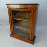 A 1930s oak and satinwood-strung pier cabinet, with single glazed door and inlaid decoration, 76cm x